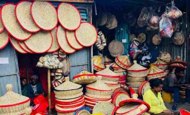Tourist exploring a Sefed shop at Mercato market in Addis Ababa