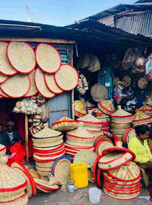Tourist exploring a Sefed shop at Mercato market in Addis Ababa