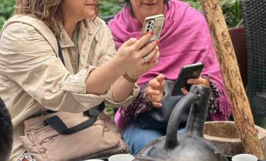 Tourists participating in a traditional Ethiopian coffee drinking ceremony