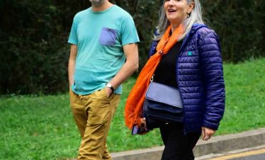 Tourists walking through a park in Addis Ababa during a city tour