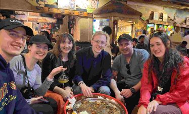 Family enjoying traditional Ethiopian food together during an Addis Ababa tour