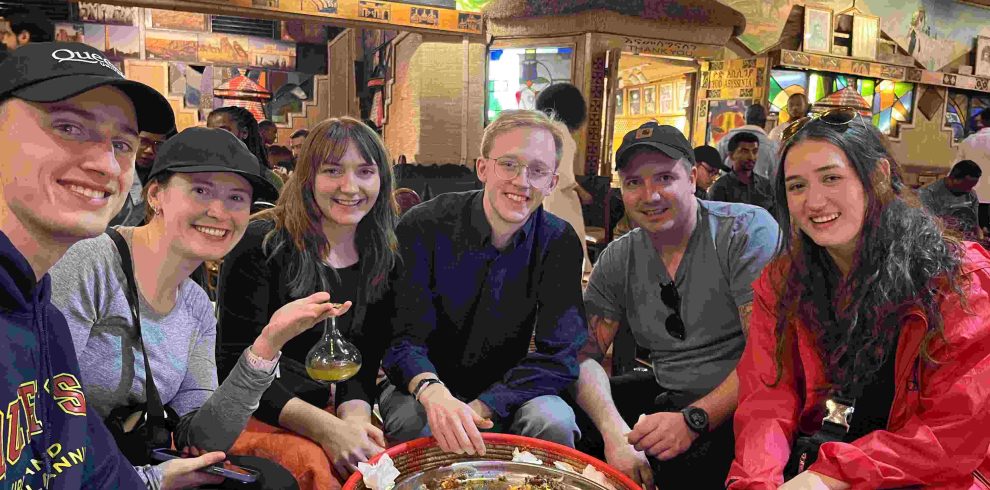 Family enjoying traditional Ethiopian food together during an Addis Ababa tour