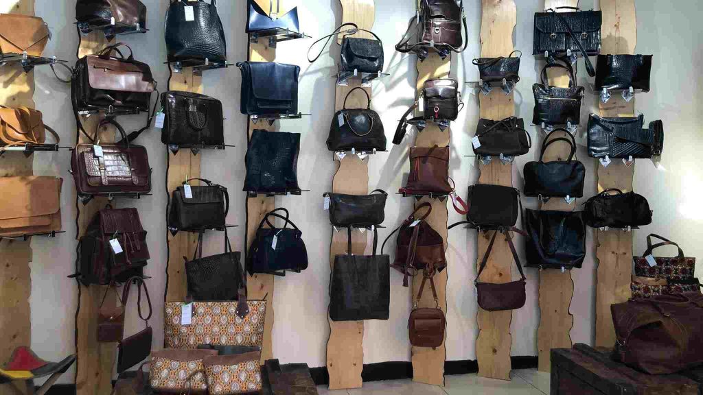 Tourists browsing leather products at a traditional leather shop in Addis Ababa