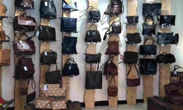 Tourists browsing leather products at a traditional leather shop in Addis Ababa