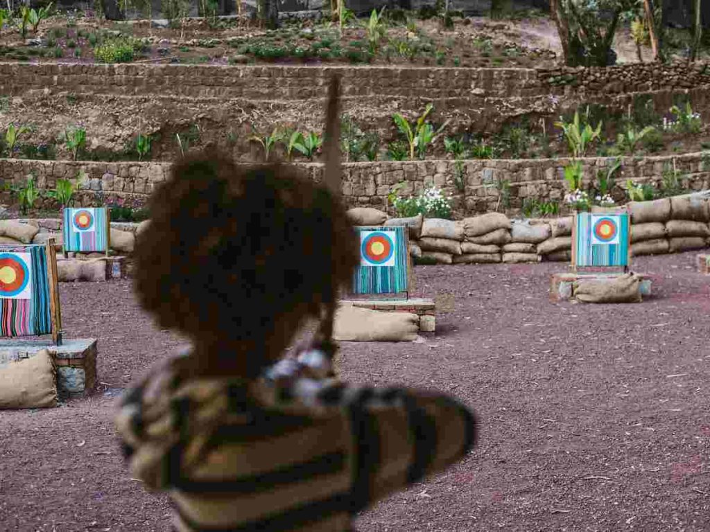 Tourists playing a target shooting game during a recreational activity in Addis Ababa