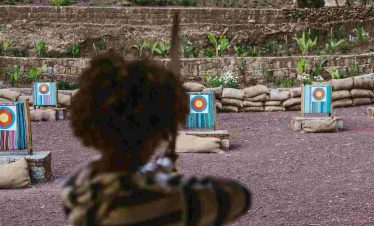 Tourists playing a target shooting game during a recreational activity in Addis Ababa