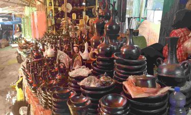 Tourists exploring a handmade clay shop in Addis Ababa during a cultural tour
