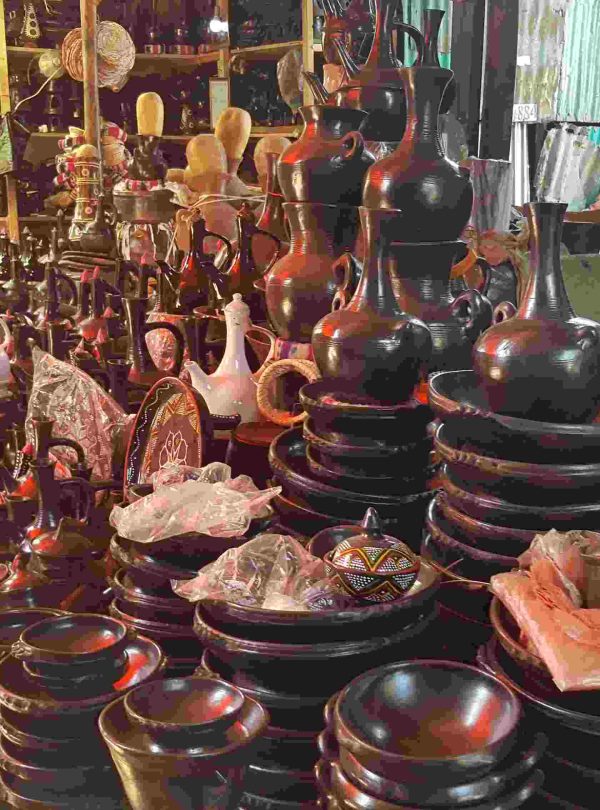 Tourists exploring a handmade clay shop in Addis Ababa during a cultural tour